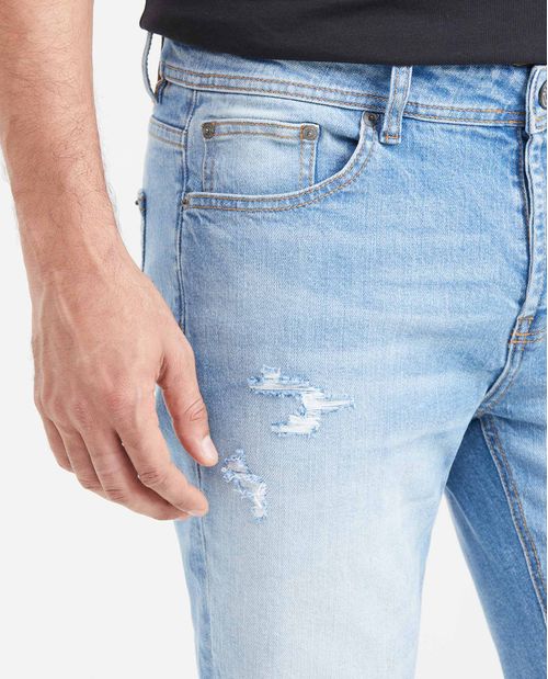 Jean Súper Slim Fit Tiro Bajo Bota Super Slim Azul Medio Claro con Rotos para Hombre